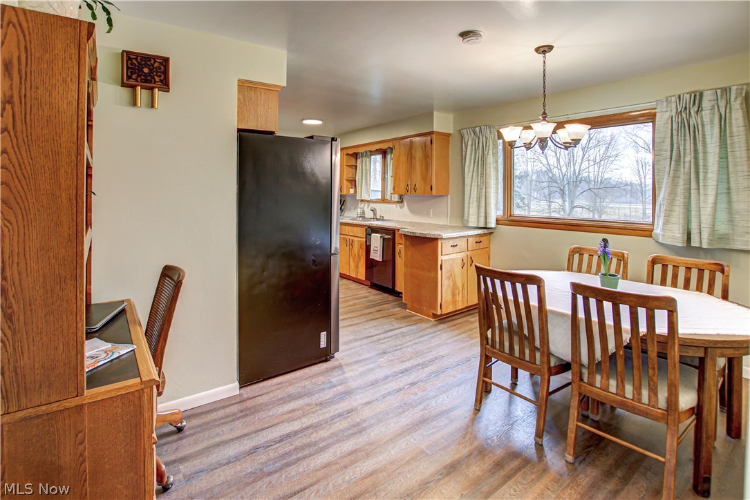 39974 Butternut Ridge Road Elyria, OH 44035 - Photo 5 of 40 Dining space featuring a notable chandelier and light hardwood / wood-style floors