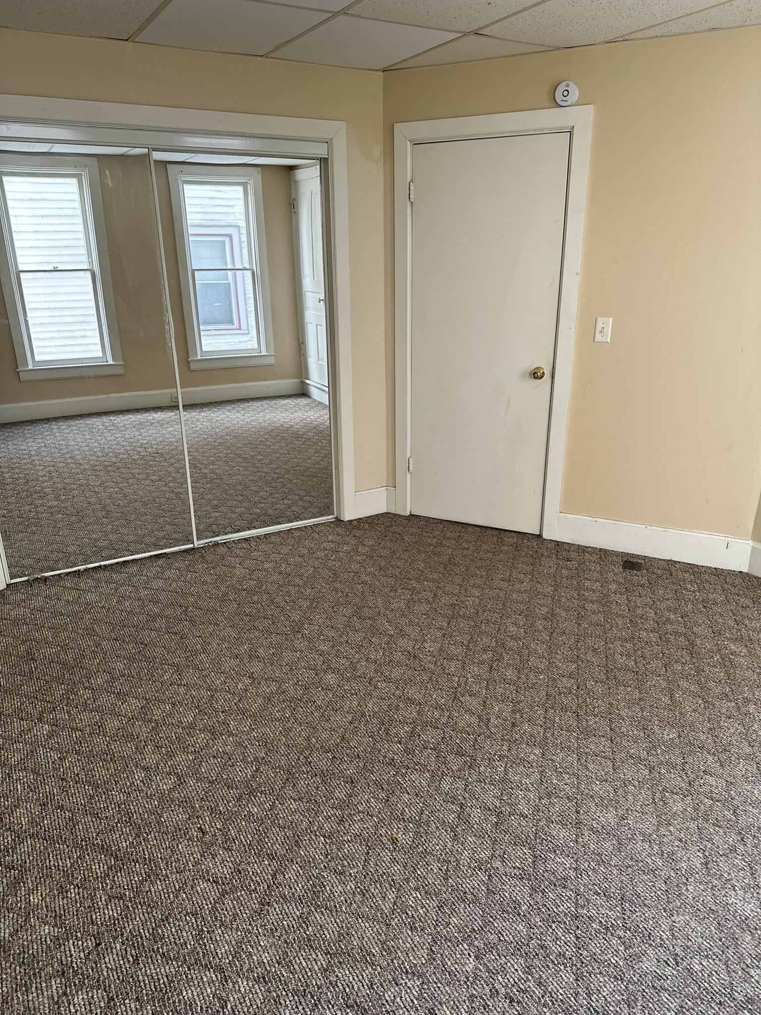 1109 South Carroll Avenue Freeport, IL 61032 - Photo 13 of 34 an empty room with windows