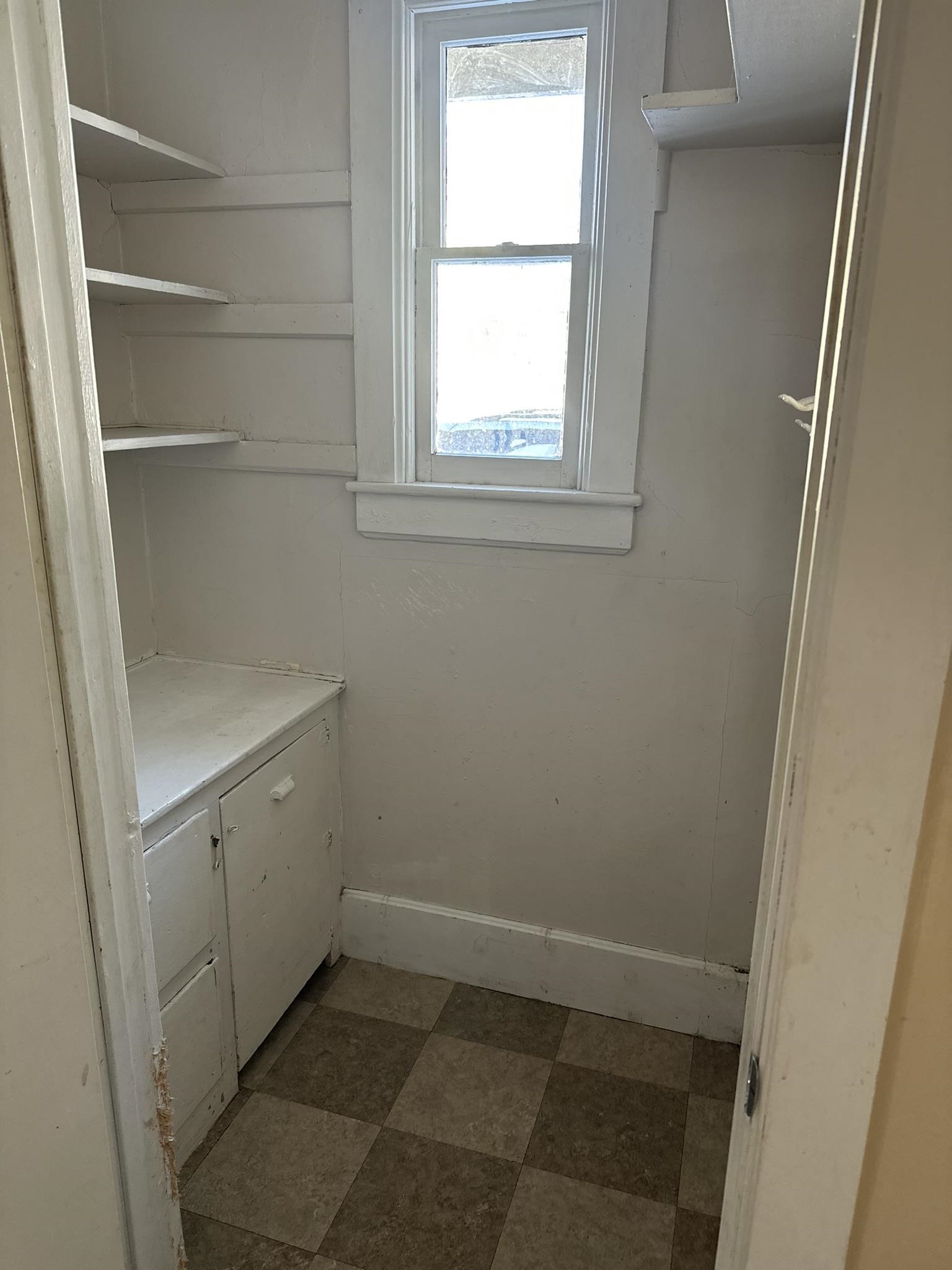 1109 South Carroll Avenue Freeport, IL 61032 - Photo 18 of 34 a view of an empty room with a window