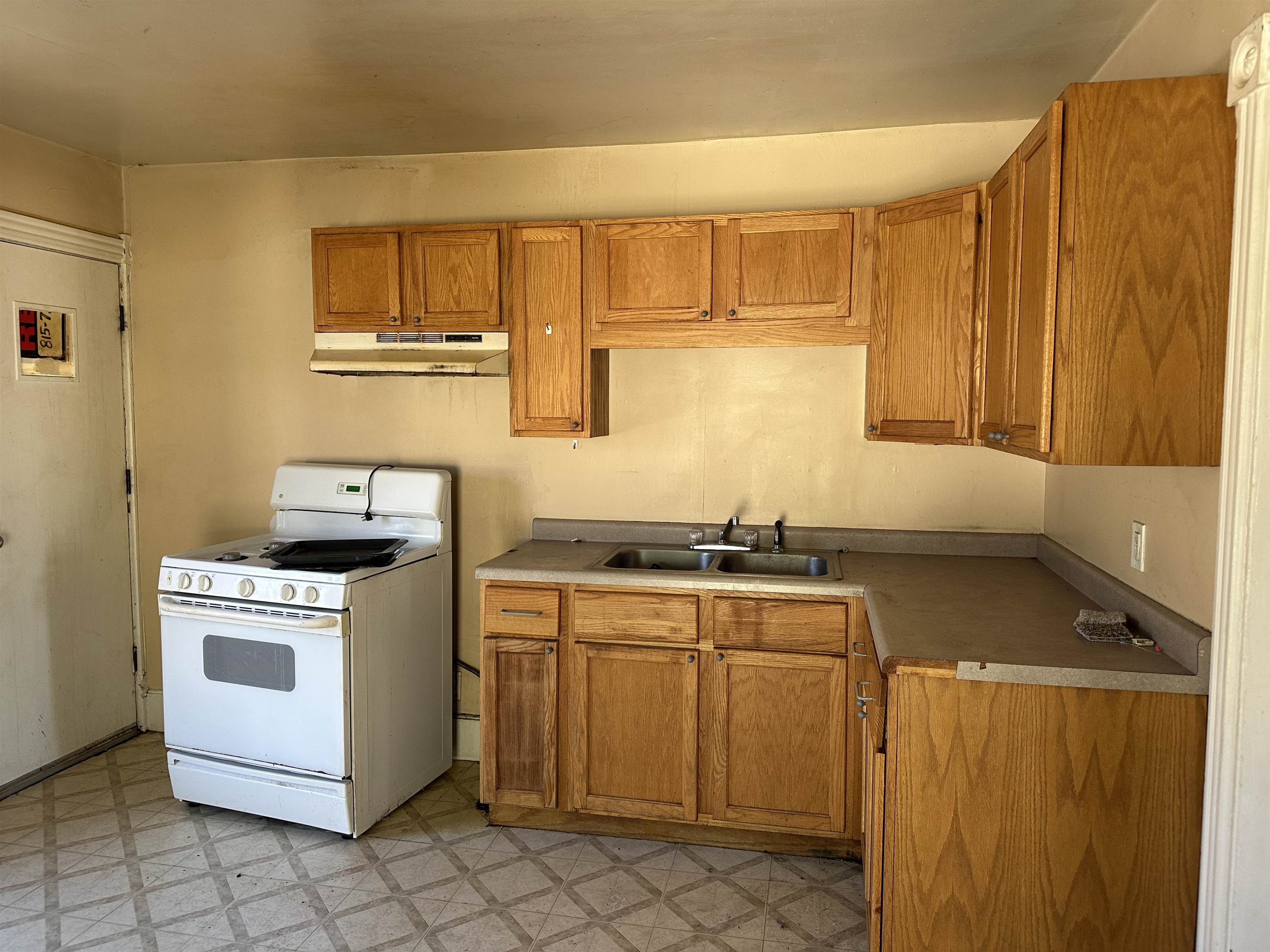 1109 South Carroll Avenue Freeport, IL 61032 - Photo 21 of 34 a kitchen with a stove top oven sink and cabinets