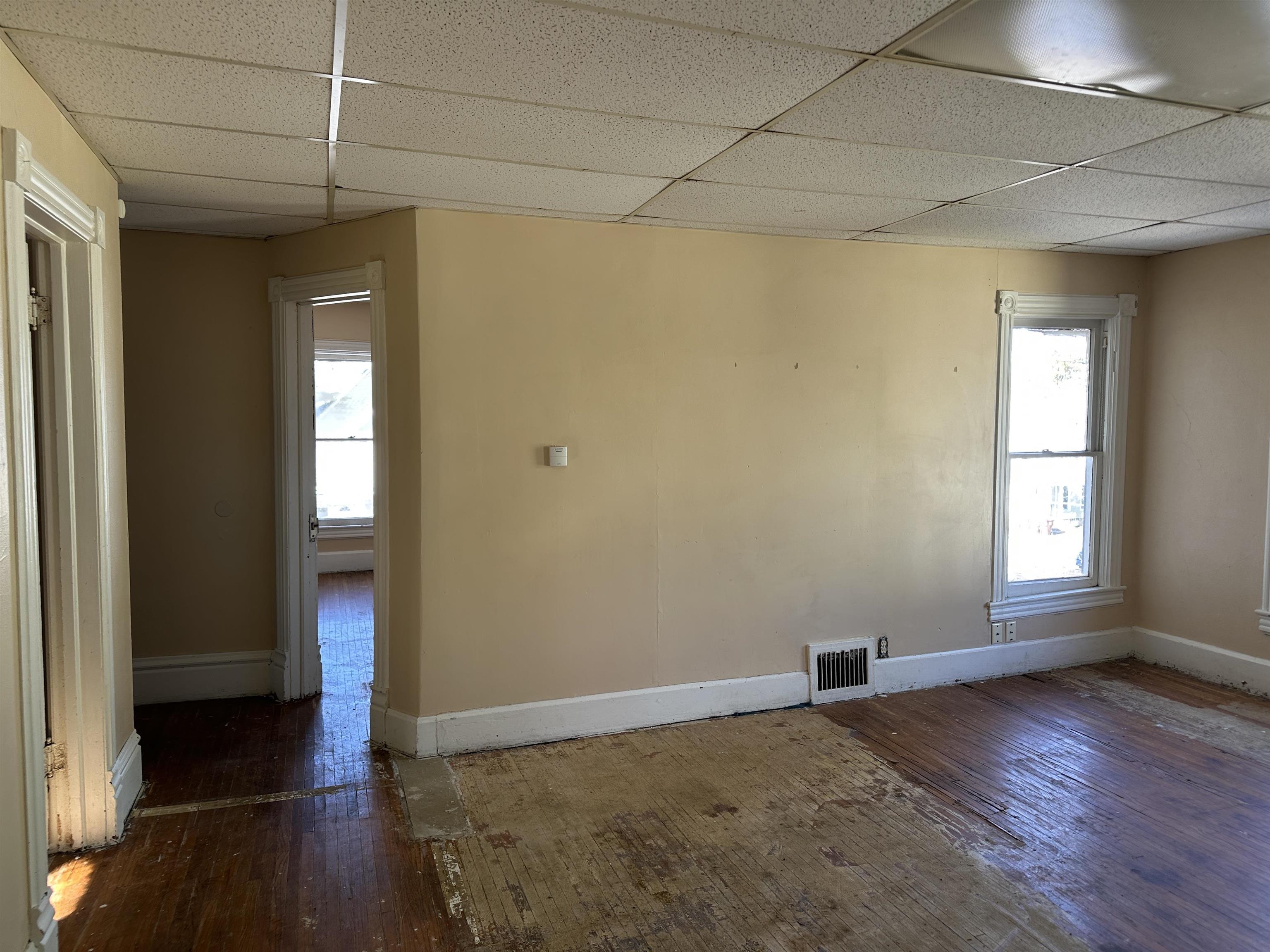 1109 South Carroll Avenue Freeport, IL 61032 - Photo 25 of 34 a view of empty room with wooden floor and fan