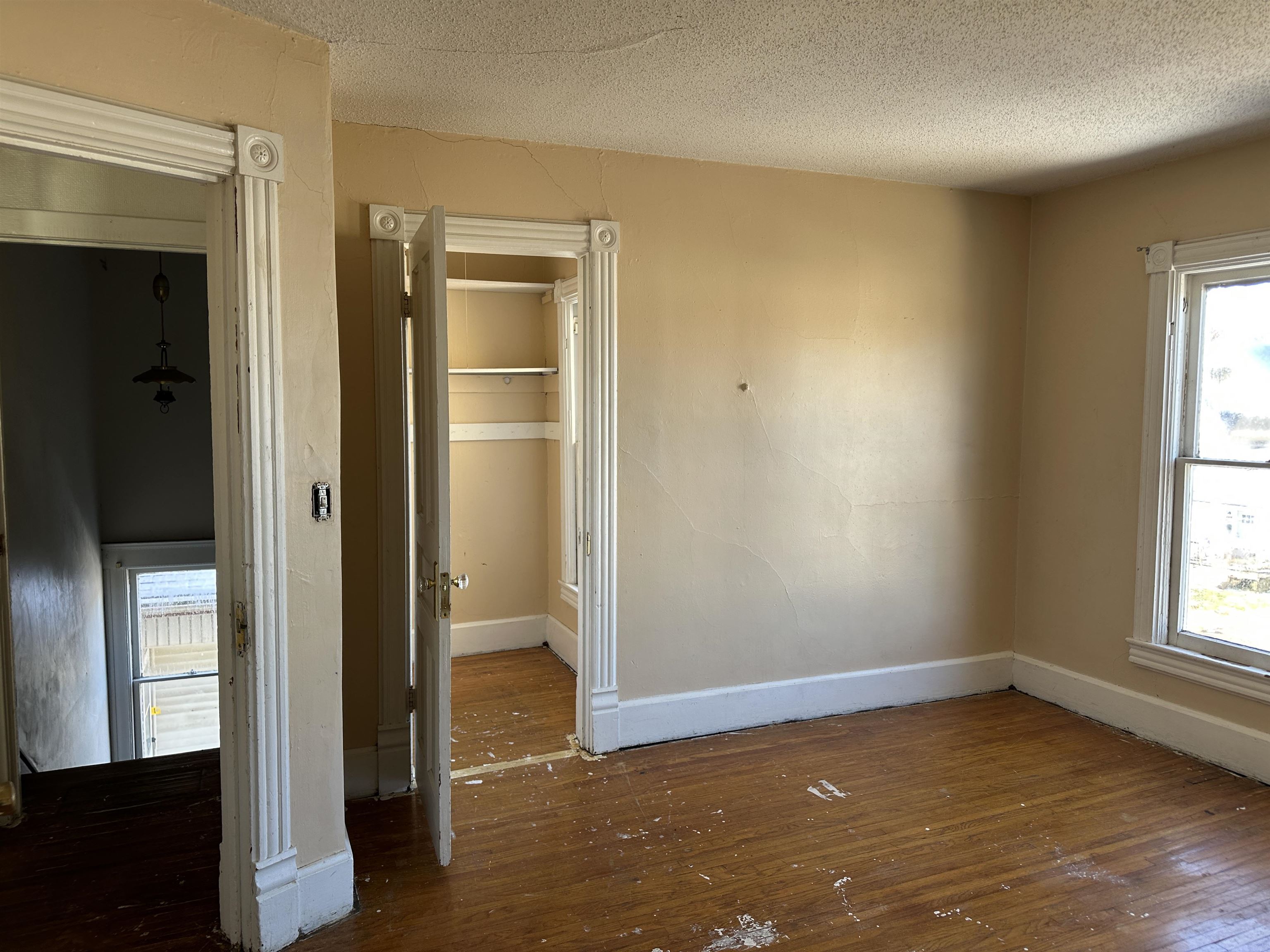 1109 South Carroll Avenue Freeport, IL 61032 - Photo 27 of 34 a view of empty room with wooden floor and fan