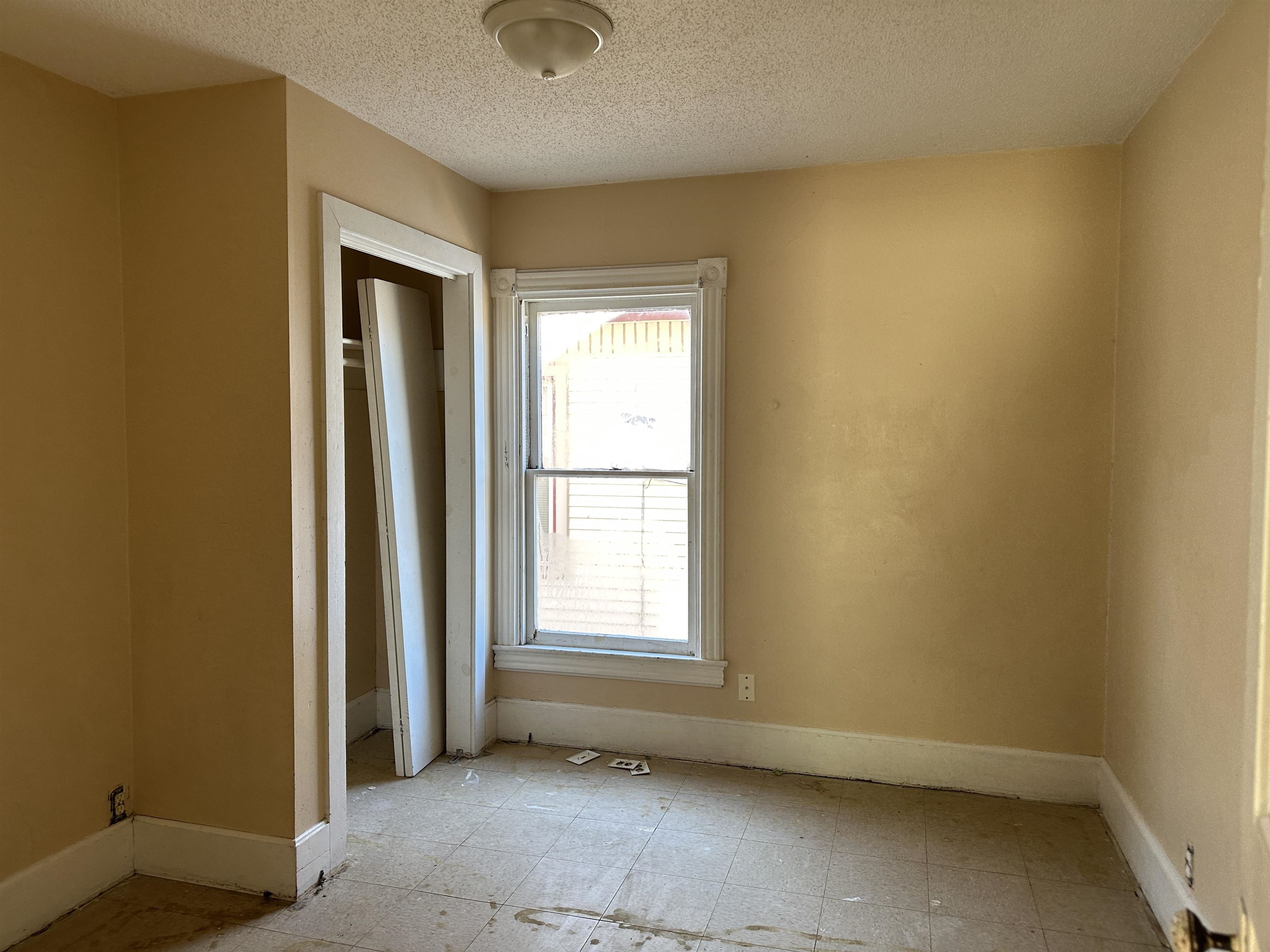 1109 South Carroll Avenue Freeport, IL 61032 - Photo 28 of 34 an empty room with a empty space and windows