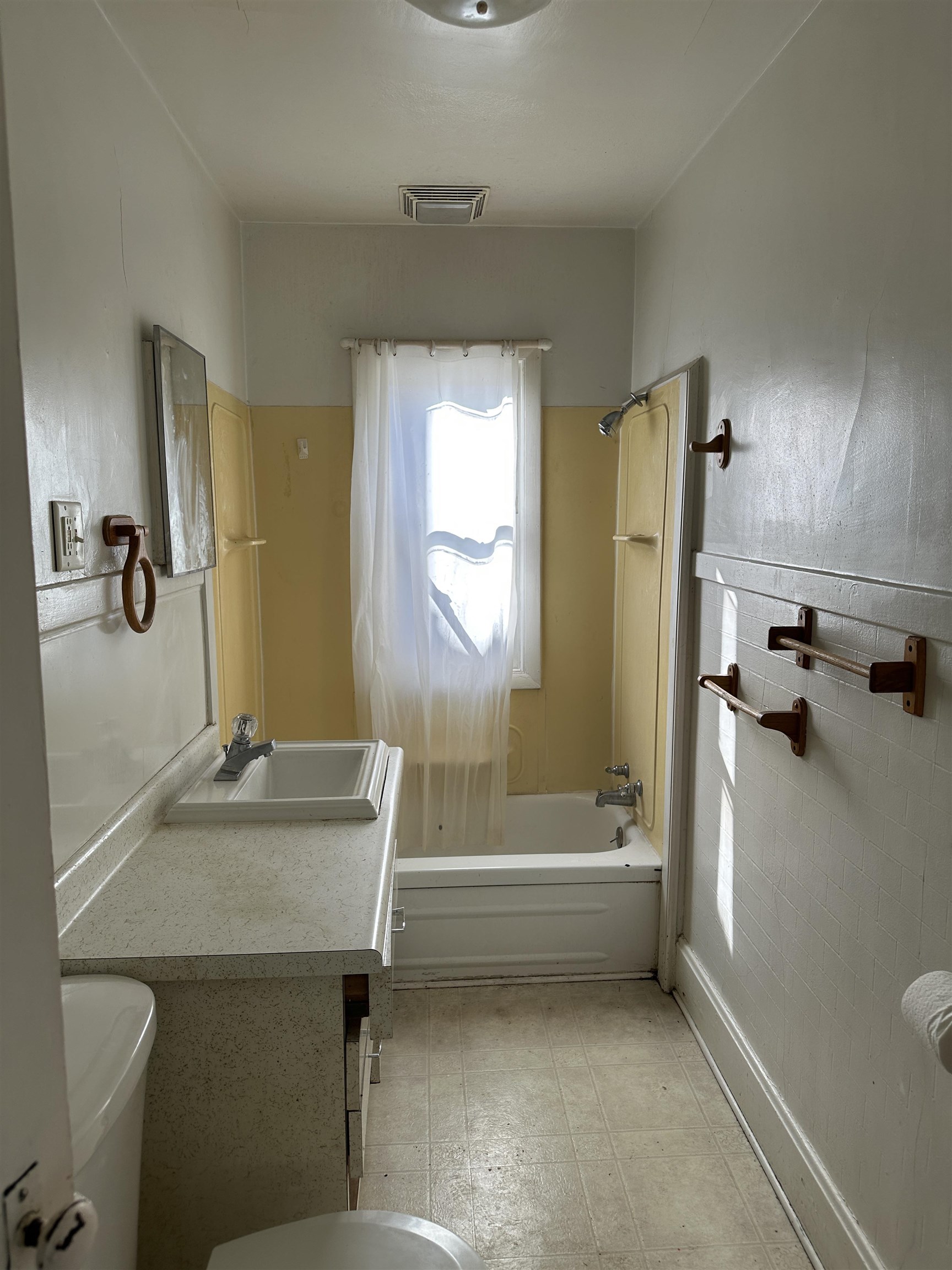 1109 South Carroll Avenue Freeport, IL 61032 - Photo 30 of 34 a bathroom with a tub sink and mirror