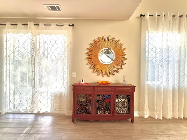 a view of a door and wooden floor
