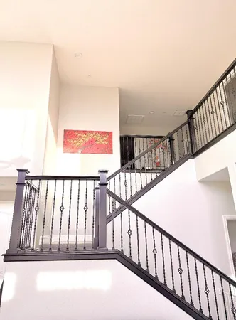 a view of staircase with white walls