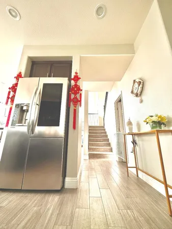 a view of front door and wooden floor