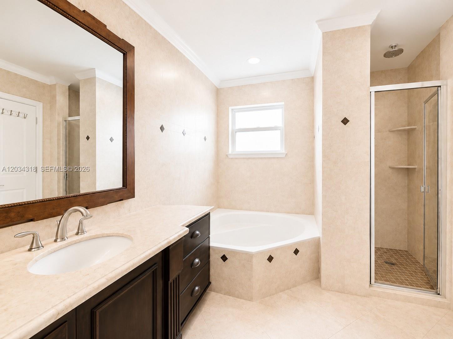 14856 Southwest 179th Street Miami, FL 33187 - Photo 18 of 33 a bathroom with a double vanity sink mirror and shower