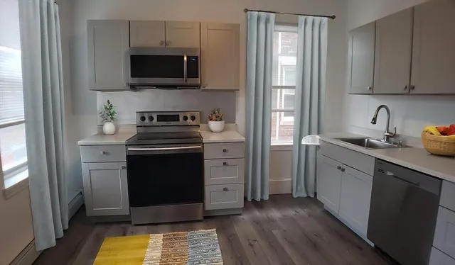 a kitchen with a stove and a microwave