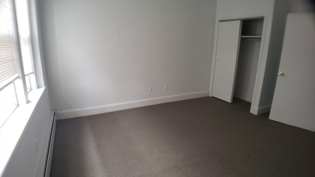 25 Chester Street, Unit 3 Boston, MA 02134 - Photo 7 of 13 an empty room with a window