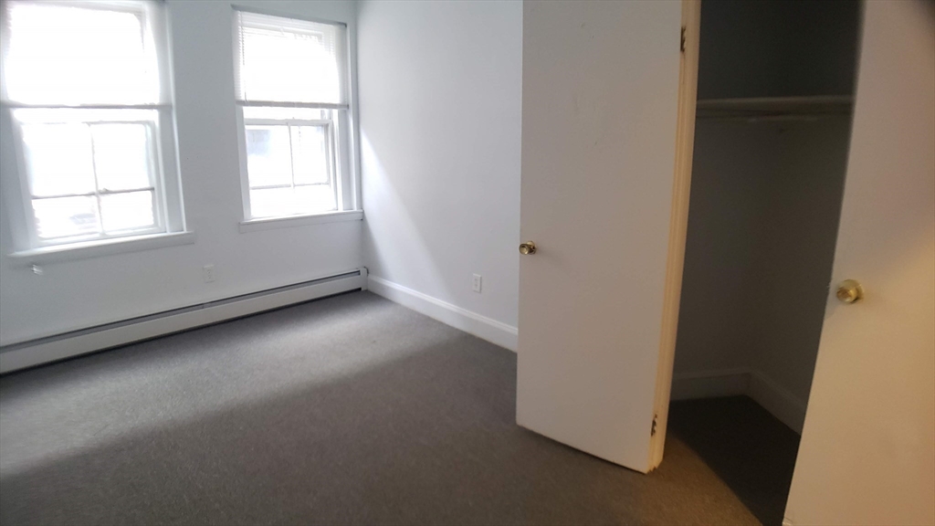 25 Chester Street, Unit 3 Boston, MA 02134 - Photo 9 of 13 an empty room with a window