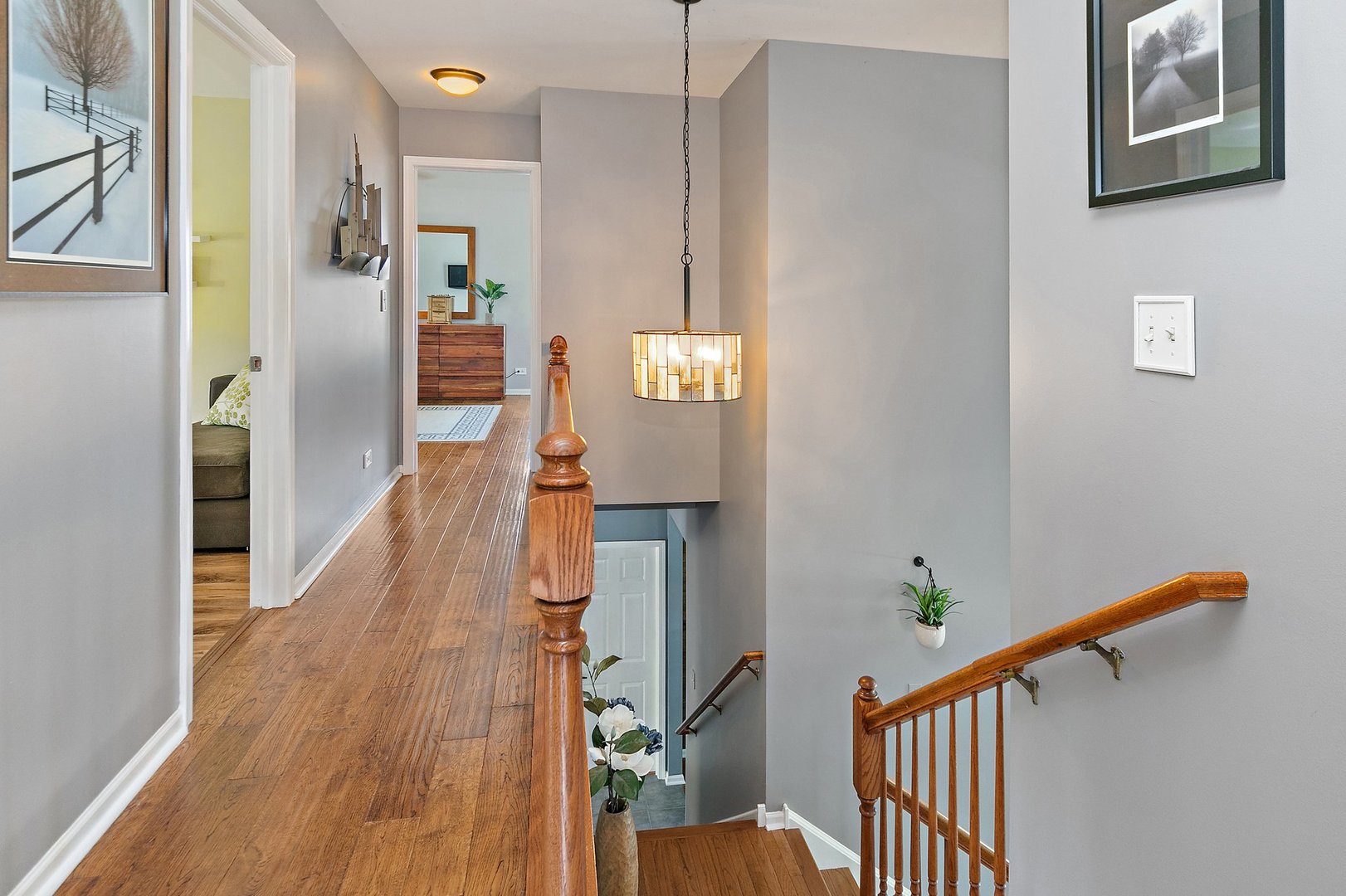 3908 Farmstead Road Carpentersville, IL 60110 - Photo 16 of 47 a view of a hallway with wooden floor and staircase
