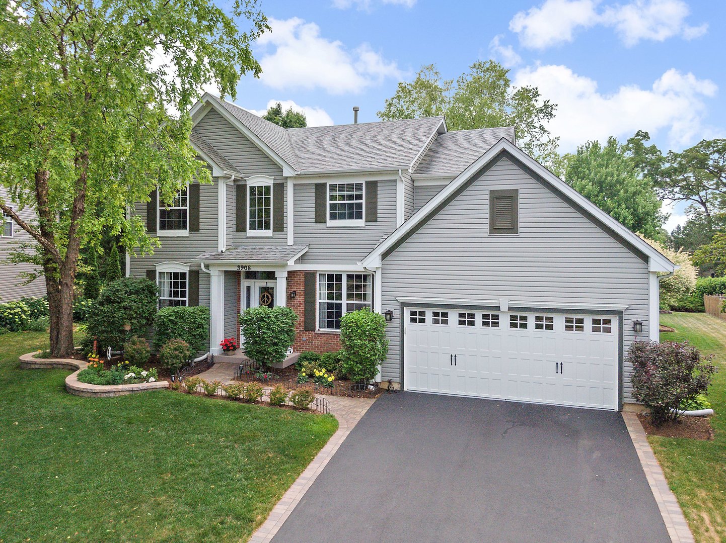 3908 Farmstead Road Carpentersville, IL 60110 - Photo 2 of 47 a view of a house with garden and yard