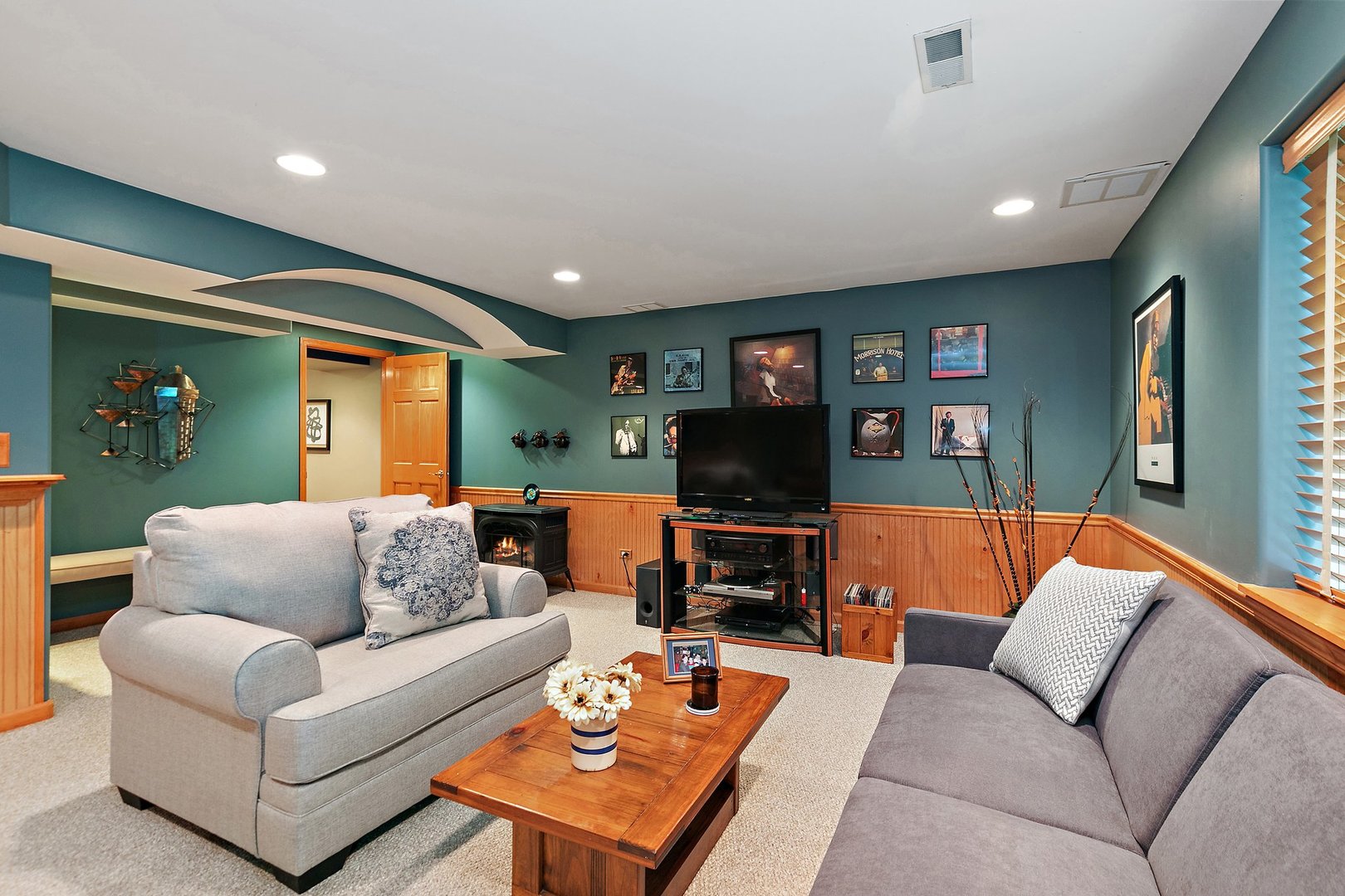 3908 Farmstead Road Carpentersville, IL 60110 - Photo 26 of 47 a living room with furniture and a flat screen tv
