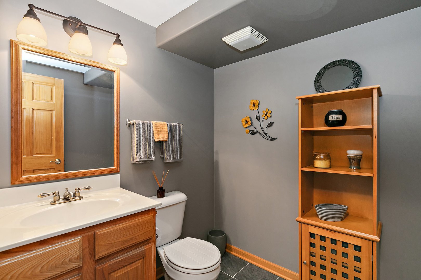 3908 Farmstead Road Carpentersville, IL 60110 - Photo 29 of 47 a bathroom with a toilet a sink and mirror