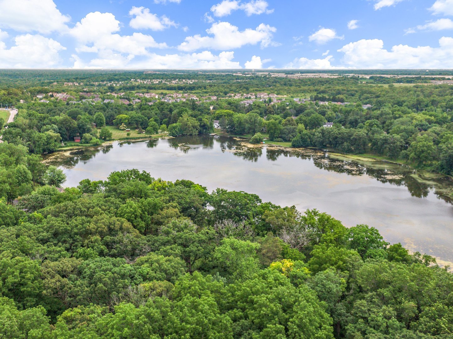 3908 Farmstead Road Carpentersville, IL 60110 - Photo 42 of 47 a view of a lake with a city
