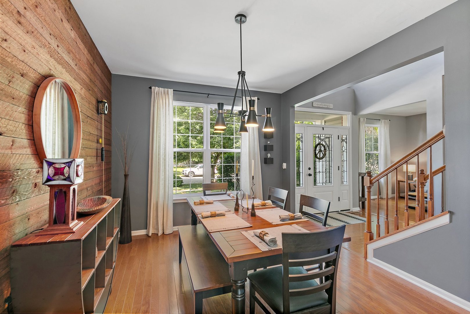 3908 Farmstead Road Carpentersville, IL 60110 - Photo 6 of 47 a view of a dining room with furniture window and wooden floor