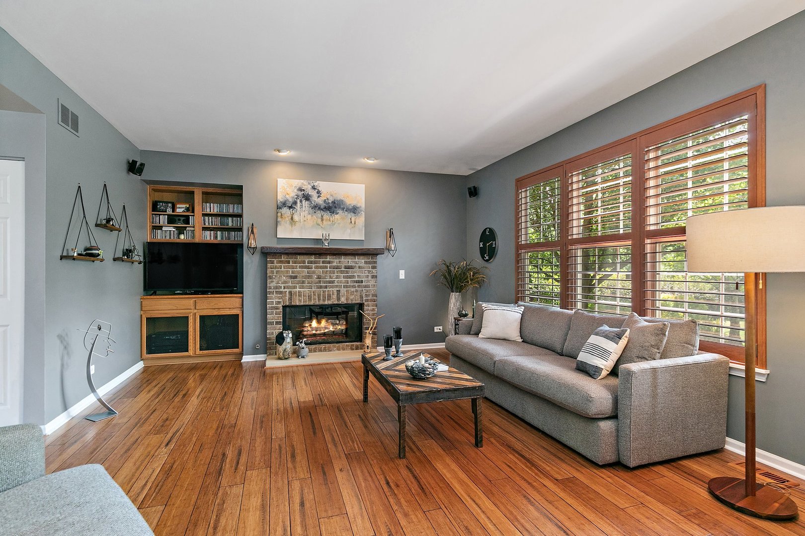 3908 Farmstead Road Carpentersville, IL 60110 - Photo 9 of 47 a living room with furniture and a fireplace