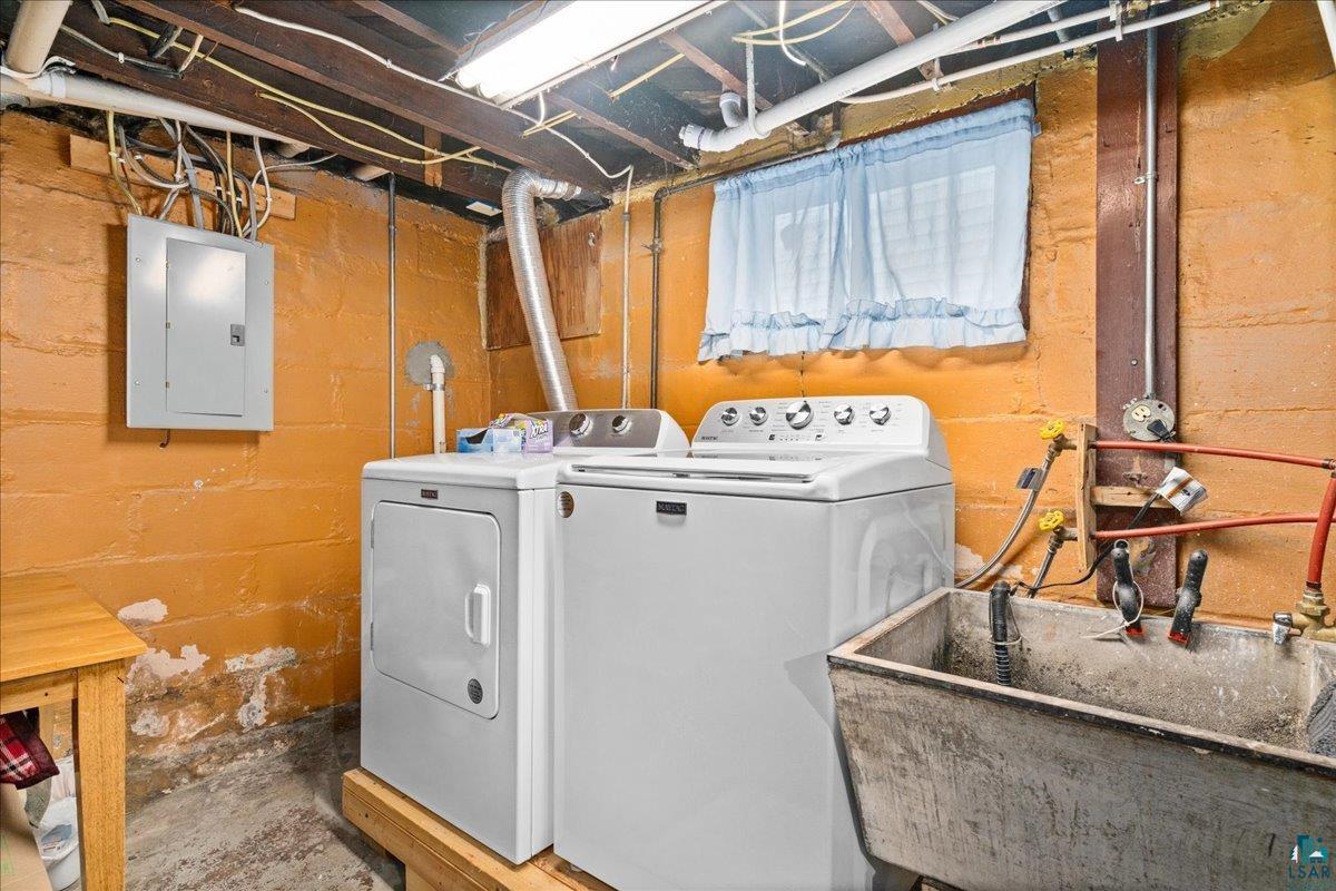 4316 West 6th Street Duluth, MN 55807 - Photo 34 of 39 Laundry area featuring electric panel, concrete floors, and washer and clothes dryer