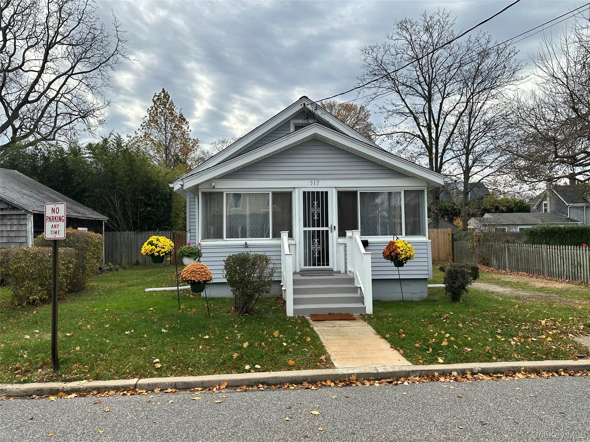 517 Flint Street Greenport, NY 11944 - Photo 2 of 20 Bungalow-style home with a sunroom
