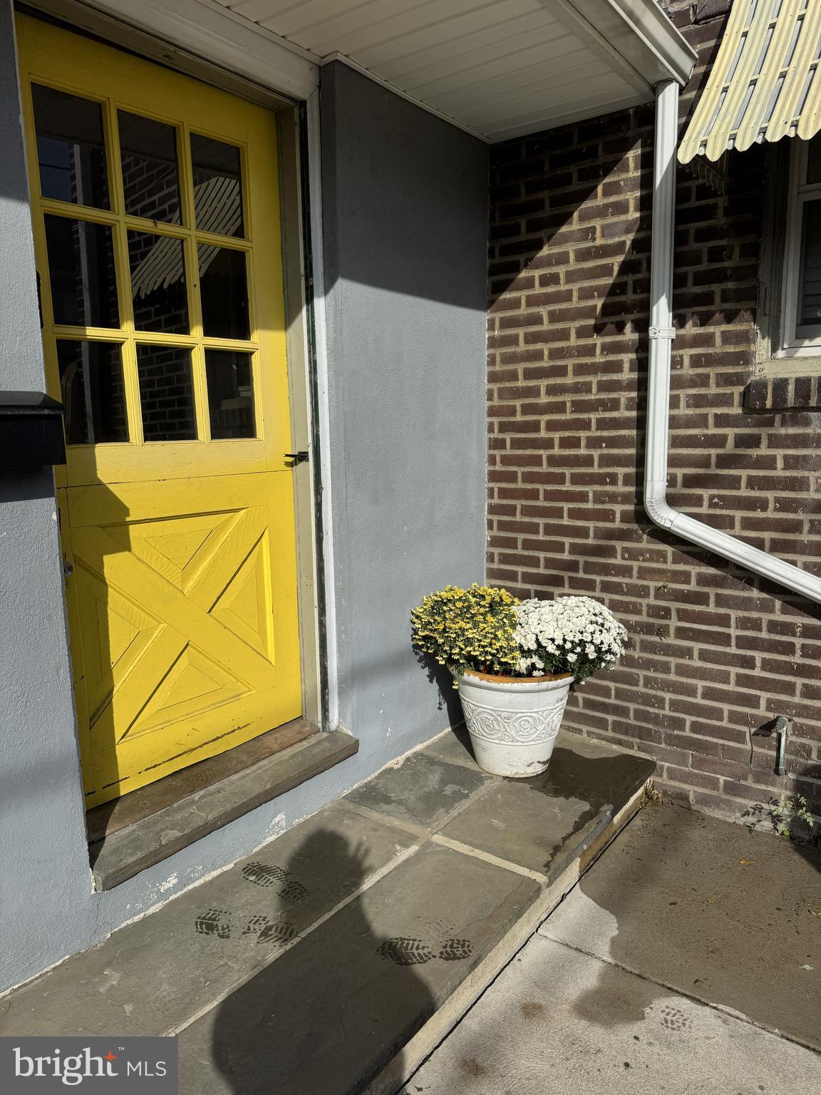 639 Spring Mill Avenue Conshohocken, PA 19428 - Photo 1 of 11 a view of a brick house with potted plants