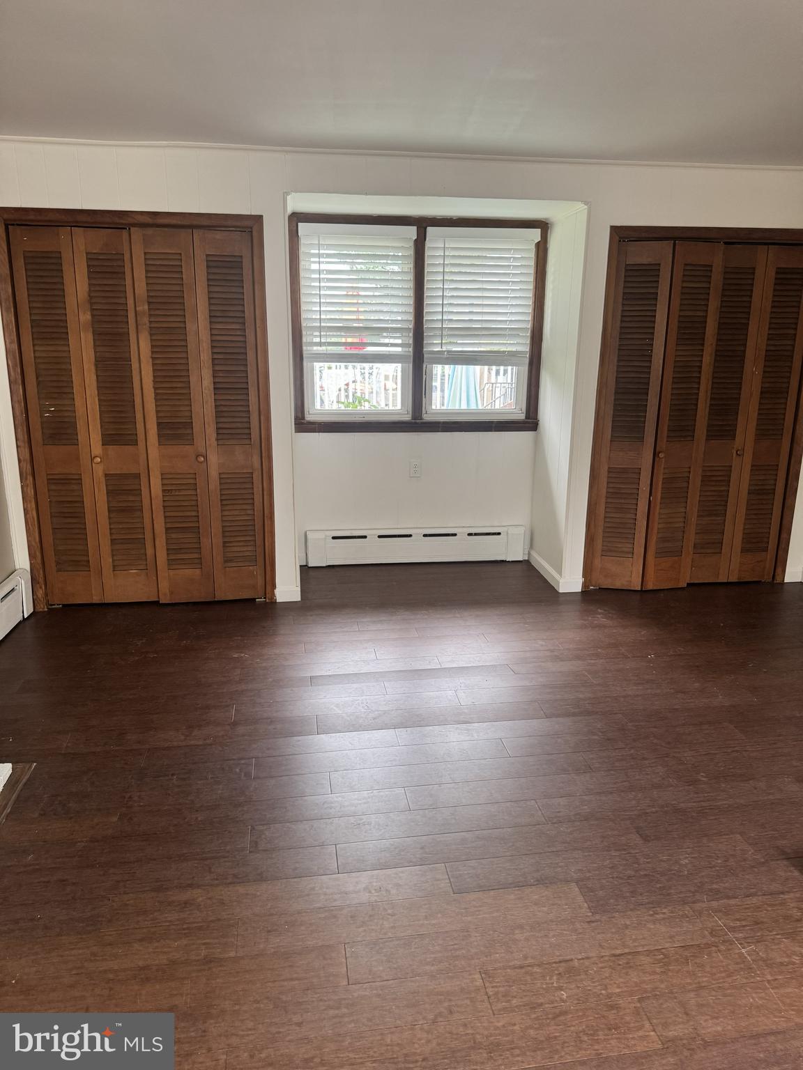 639 Spring Mill Avenue Conshohocken, PA 19428 - Photo 4 of 11 an empty room with wooden floor and windows