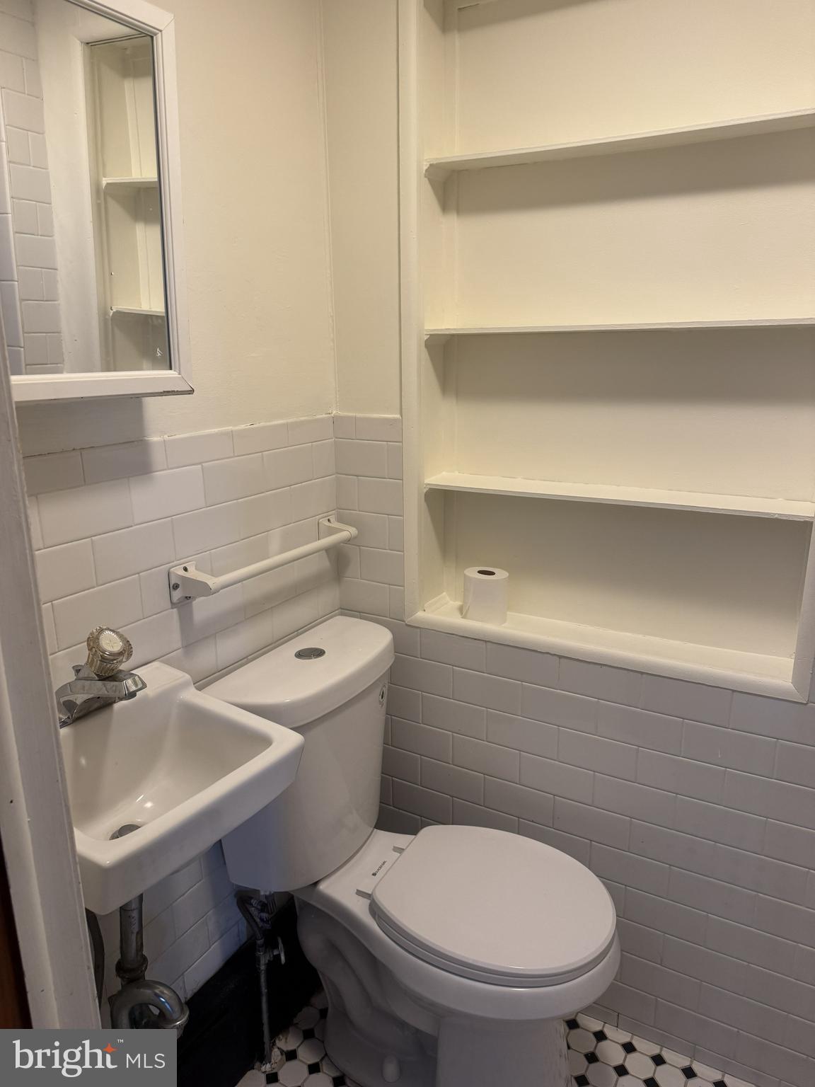 639 Spring Mill Avenue Conshohocken, PA 19428 - Photo 7 of 11 a bathroom with a sink a toilet and a mirror