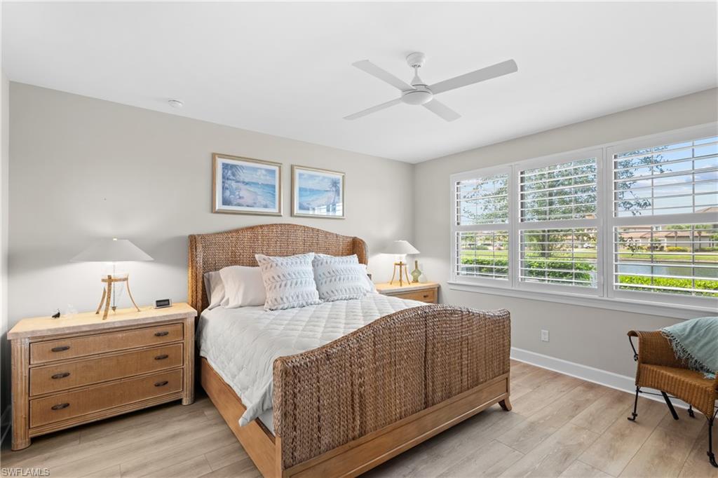 9646 Montelanico Loop, Unit 102 Naples, FL 34119 - Photo 12 of 42 a bed room with a bed and a window