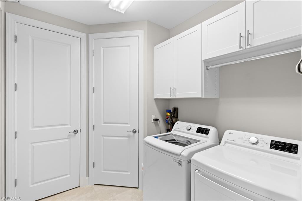 9646 Montelanico Loop, Unit 102 Naples, FL 34119 - Photo 19 of 42 a view of storage and utility room with washer and dryer