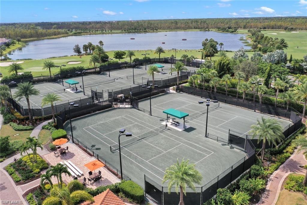 9646 Montelanico Loop, Unit 102 Naples, FL 34119 - Photo 42 of 42 an aerial view of a house with a lake view