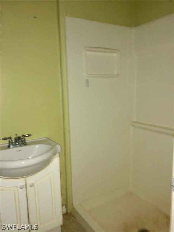 7206 Jasmine Road Fort Myers, FL 33967 - Photo 11 of 29 a bathroom with a sink and a mirror