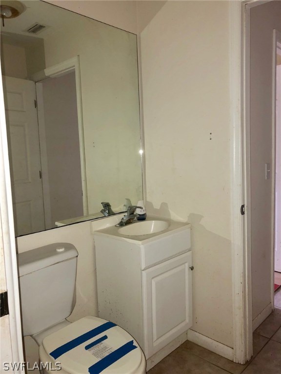 7206 Jasmine Road Fort Myers, FL 33967 - Photo 16 of 29 a bathroom with a sink a toilet and a mirror