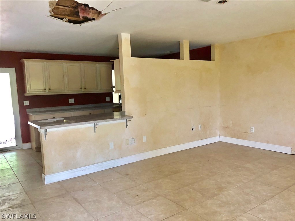 7206 Jasmine Road Fort Myers, FL 33967 - Photo 5 of 29 a bathroom with a sink and a mirror