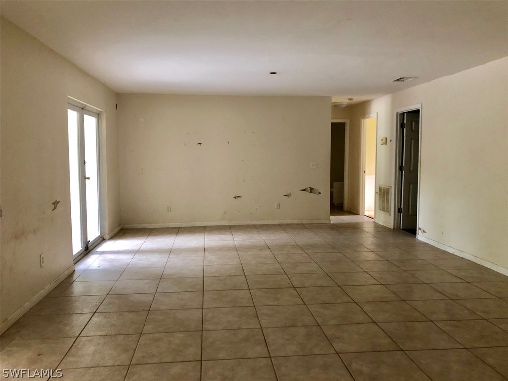 7206 Jasmine Road Fort Myers, FL 33967 - Photo 8 of 29 a view of an empty room and window