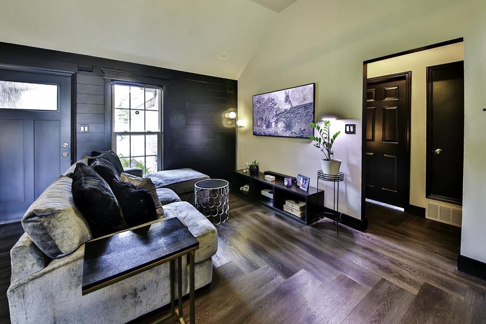4736 Ridge Walk Lane Memphis, TN 38125 - Photo 5 of 23 Living room featuring dark wood-type flooring and vaulted ceiling