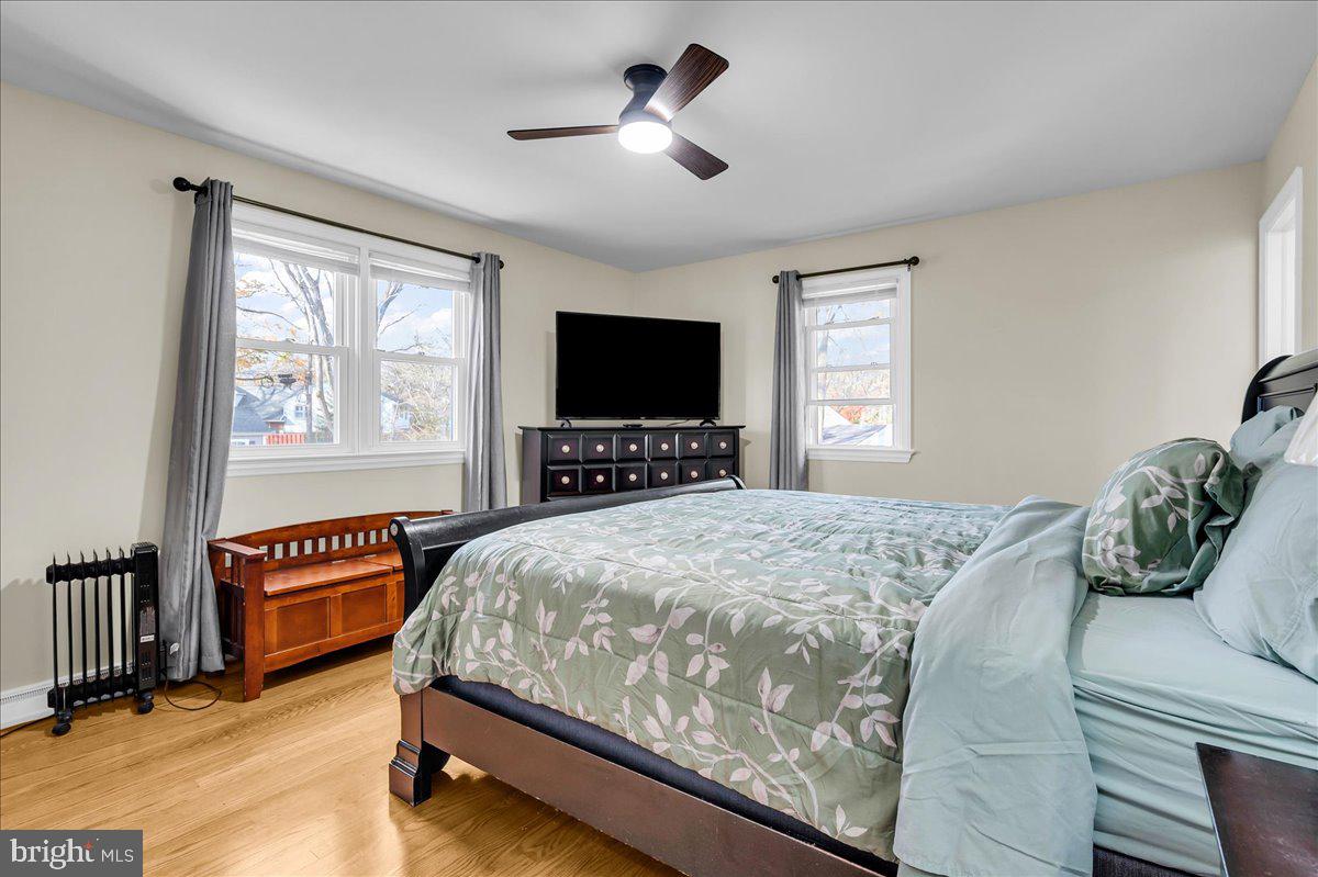 1909 Foulk Road Wilmington, DE 19810 - Photo 16 of 31 a bedroom with a bed and wooden floor