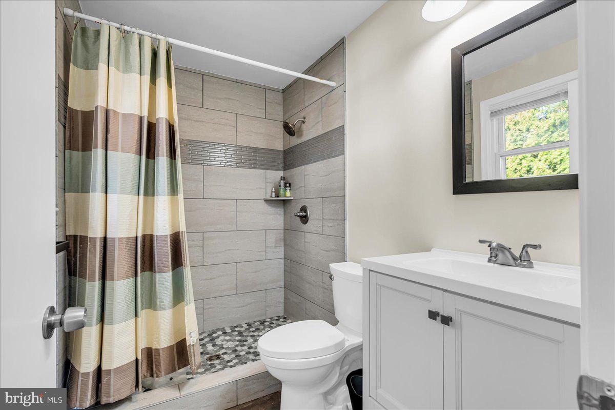 1909 Foulk Road Wilmington, DE 19810 - Photo 17 of 31 a bathroom with a sink toilet and shower