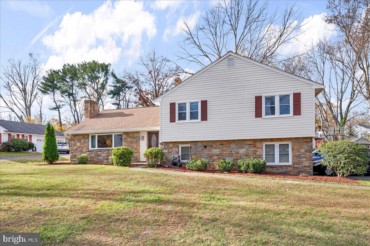 1909 Foulk Road Wilmington, DE 19810 - Photo 2 of 31 a front view of a house with a garden