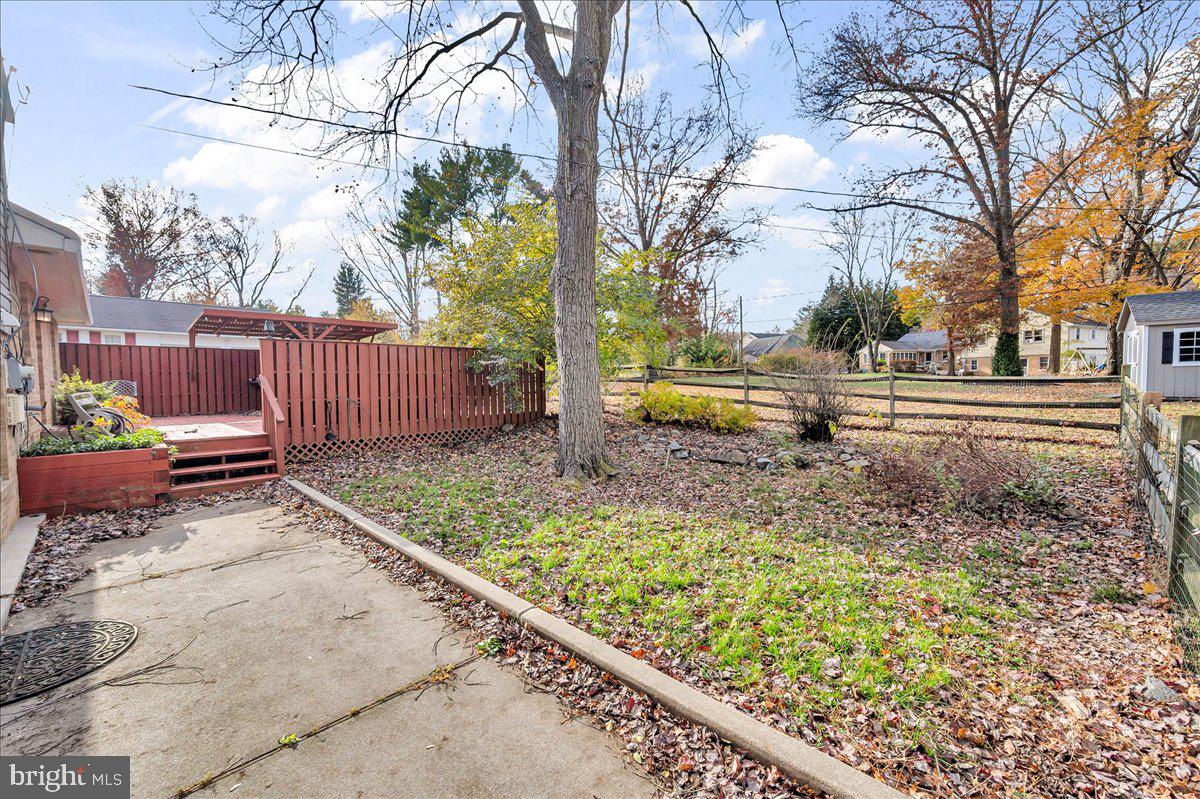 1909 Foulk Road Wilmington, DE 19810 - Photo 22 of 31 a view of a backyard with wooden fence