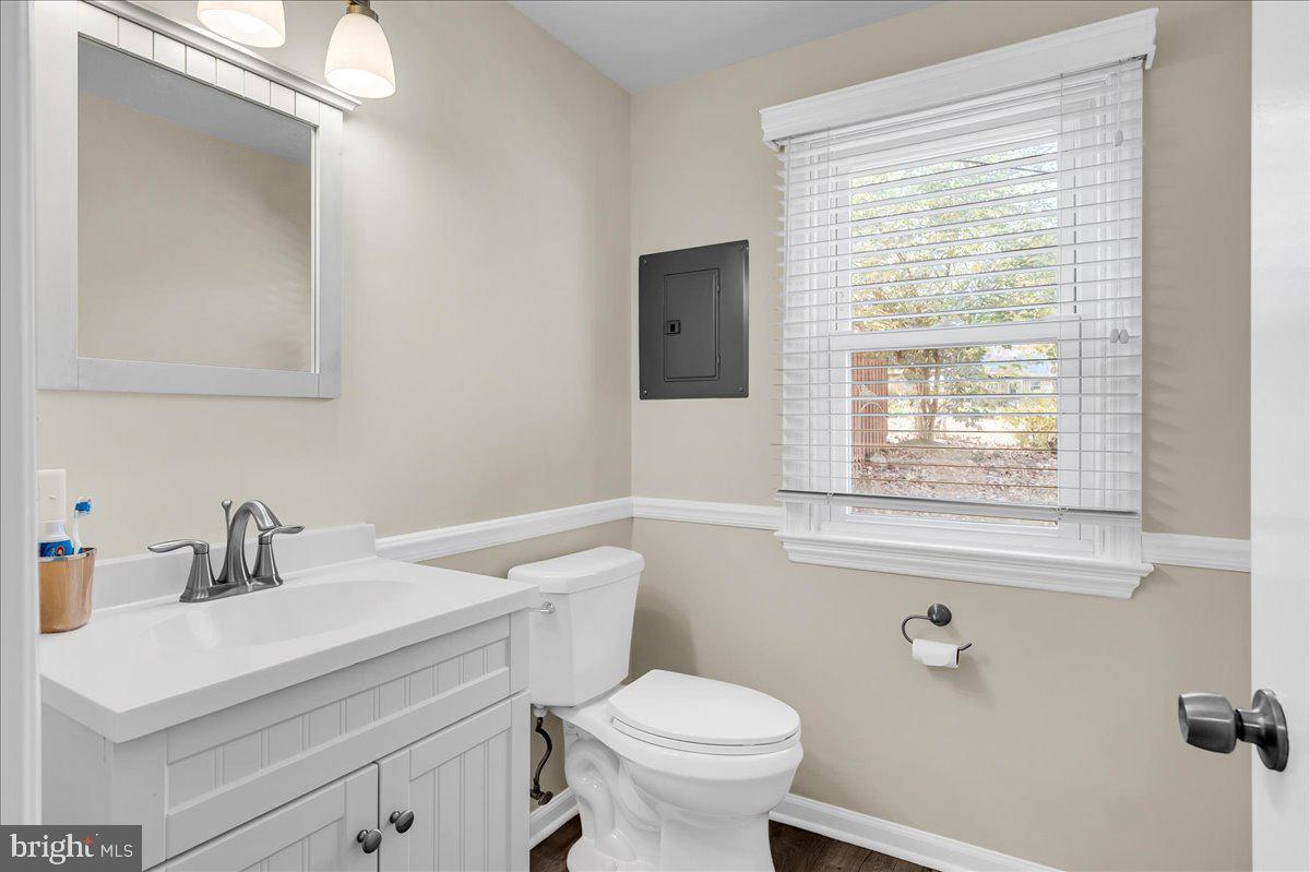 1909 Foulk Road Wilmington, DE 19810 - Photo 5 of 31 a bathroom with a sink a toilet and a window
