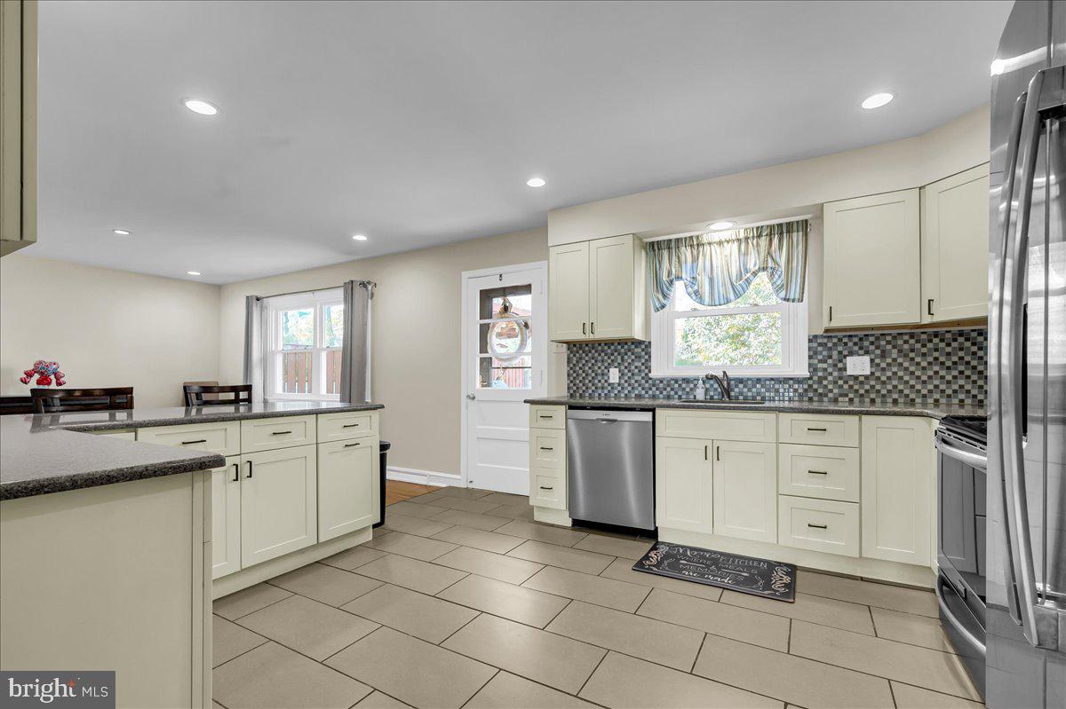 1909 Foulk Road Wilmington, DE 19810 - Photo 8 of 31 a kitchen with granite countertop cabinets a sink and appliances