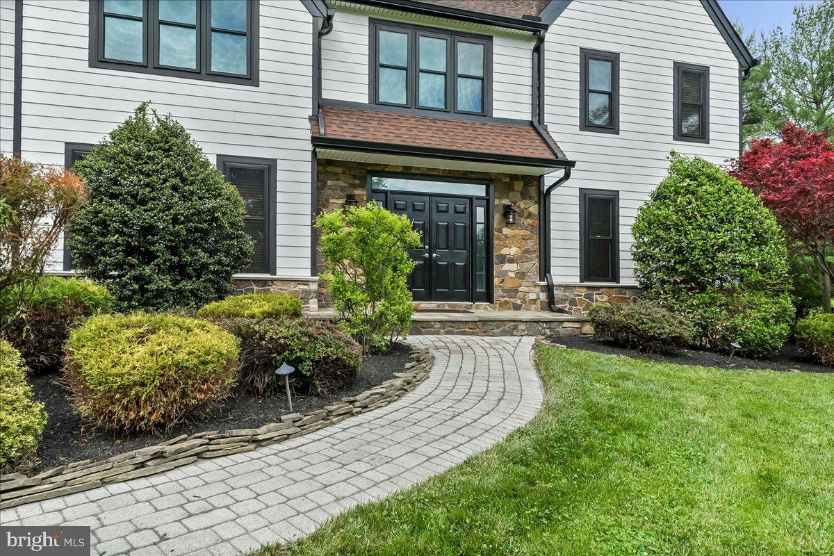 51 Ridings Way Chadds Ford, PA 19317 - Photo 4 of 57 a front view of a house with garden