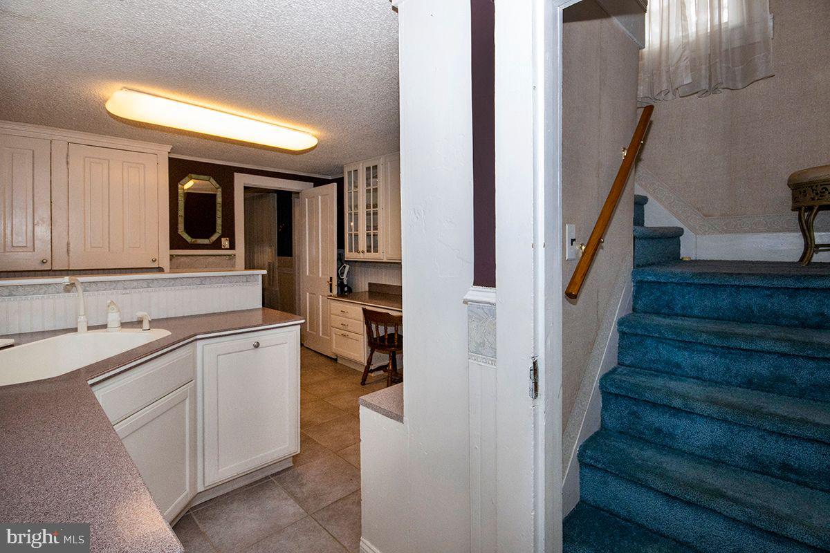339 Central Avenue Hammonton, NJ 08037 - Photo 38 of 56 2nd Kitchen/Laundry, Stairs Up to "Auntie Suite"
