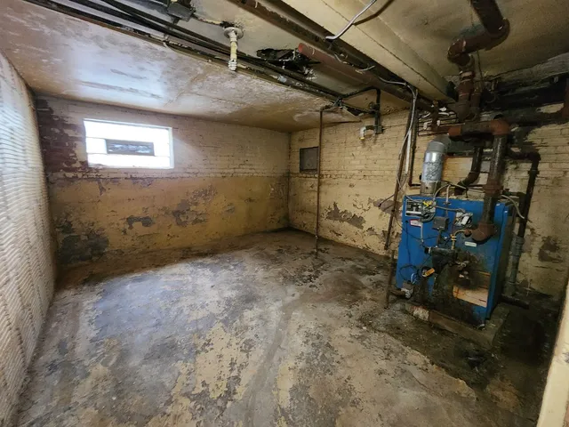 a view of a room with a wooden floor and a window