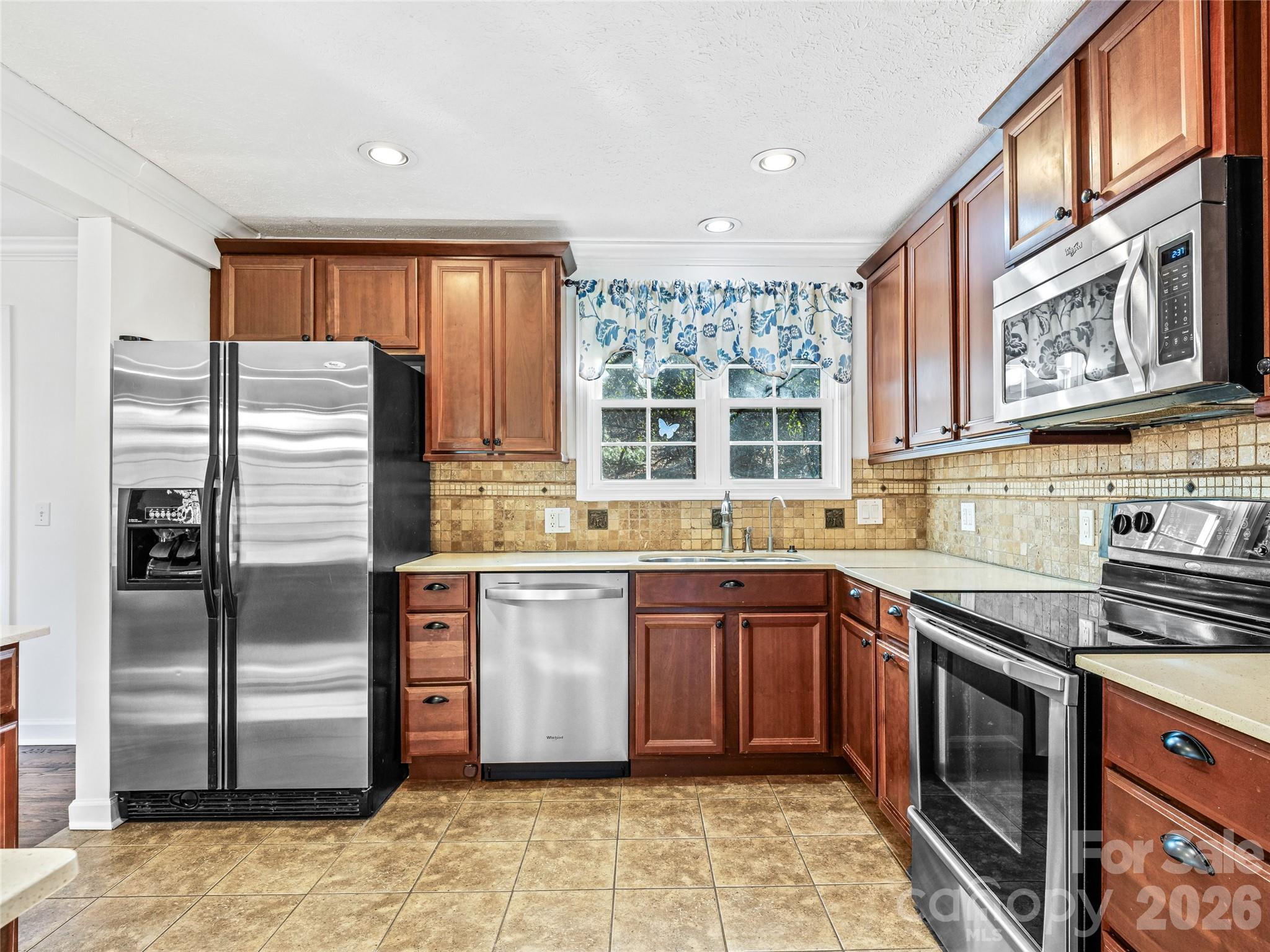 2388 Hebron Road Hendersonville, NC 28739 - Photo 18 of 42 a kitchen with stainless steel appliances granite countertop a refrigerator and a sink