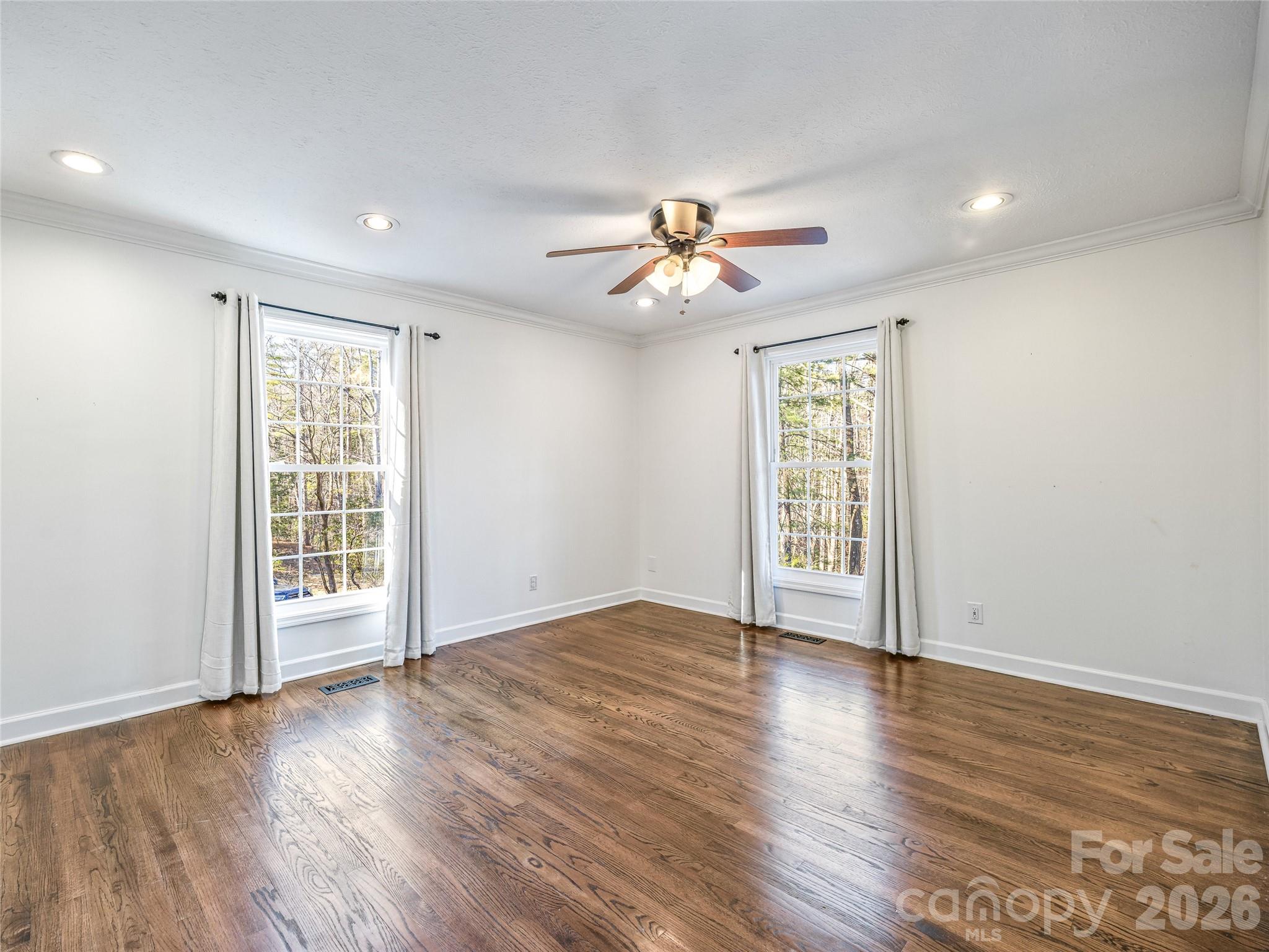 2388 Hebron Road Hendersonville, NC 28739 - Photo 23 of 42 a view of an empty room with a window and wooden floor