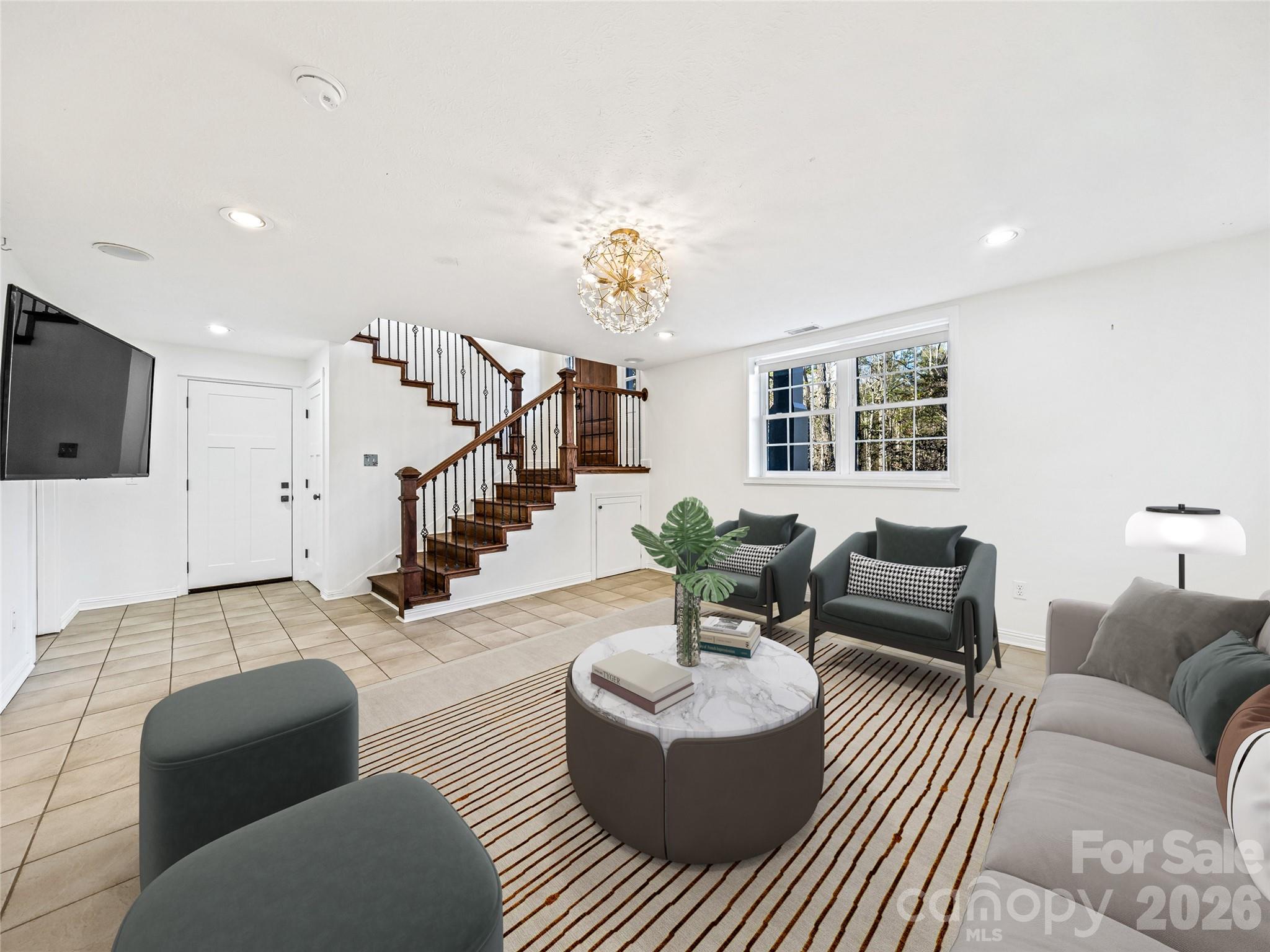 2388 Hebron Road Hendersonville, NC 28739 - Photo 34 of 42 a living room with furniture and a flat screen tv