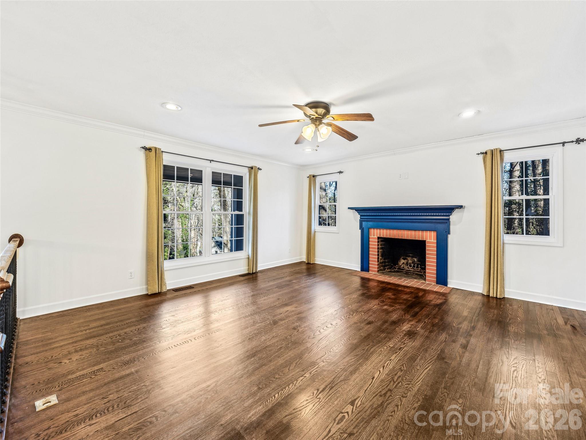 2388 Hebron Road Hendersonville, NC 28739 - Photo 8 of 42 a view of an empty room with a fireplace and a window