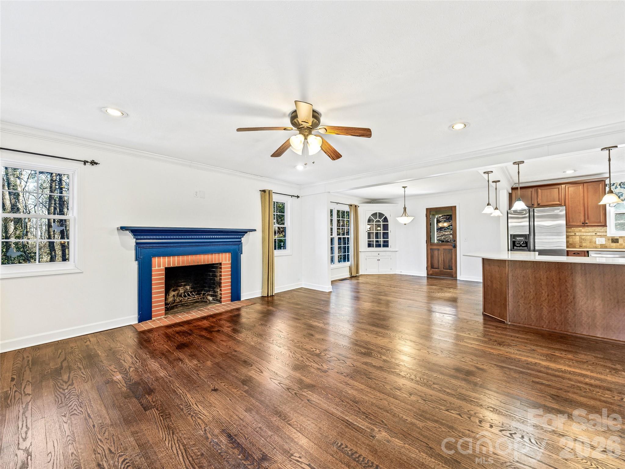 2388 Hebron Road Hendersonville, NC 28739 - Photo 10 of 42 a view of empty room with wooden floor and fan