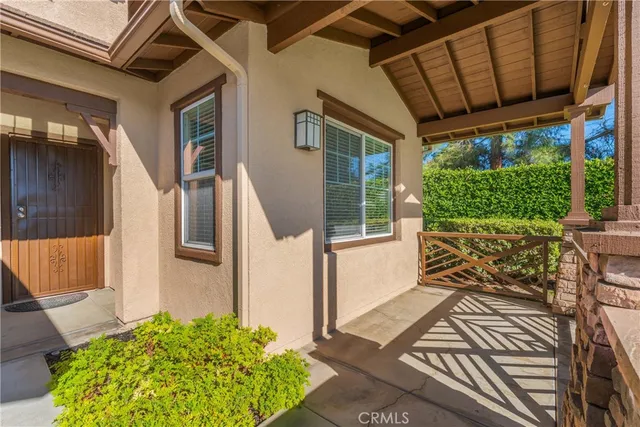 a view of a porch with wooden floor and outdoor space